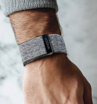 Whoop band 4 grey knitted band on a male arm
